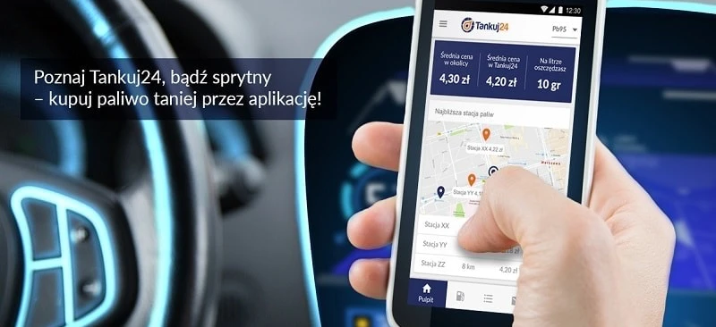 Tekst alternatywny obrazu: Urządzenie elektroniczne wyświetlające informacje o cenach paliwa i pobliskich stacjach benzynowych, promujące aplikację Tankuj24 do inteligentnego tankowania. Oszczędzaj pieniądze, tankując Pb95 za 4,20 zł za litr.